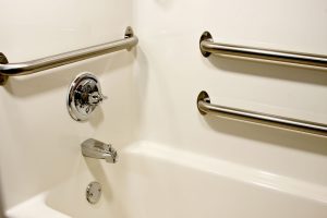 chrome grab safety bars in a handicap bathtub